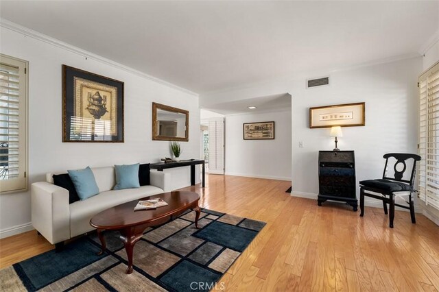 5231 Hiram Ln, Irvine, CA 92603 - living room with ornamental molding and light wood finished floors