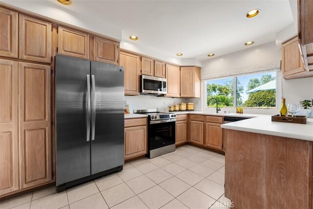 5231 Hiram Ln, Irvine, CA 92603 - kitchen with stainless steel appliances, light tile patterned flooring, light countertops, and recessed lighting