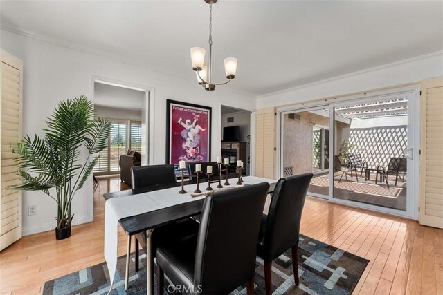 5231 Hiram Ln, Irvine, CA 92603 - dining room featuring hardwood / wood-style floors, a chandelier, and ornamental molding