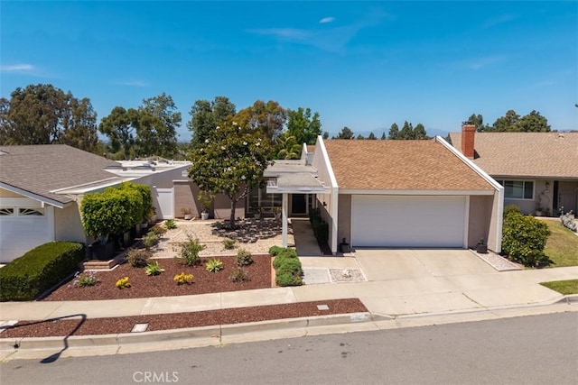 5231 Hiram Ln, Irvine, CA 92603 - view of front of house featuring an attached garage, stucco siding, driveway, and a chimney