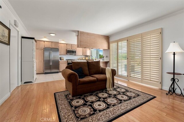 5231 Hiram Ln, Irvine, CA 92603 - living area featuring light wood-style flooring and crown molding