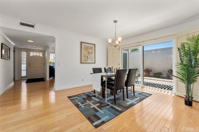 5231 Hiram Ln, Irvine, CA 92603 - dining space with a chandelier, light wood-style floors, and ornamental molding