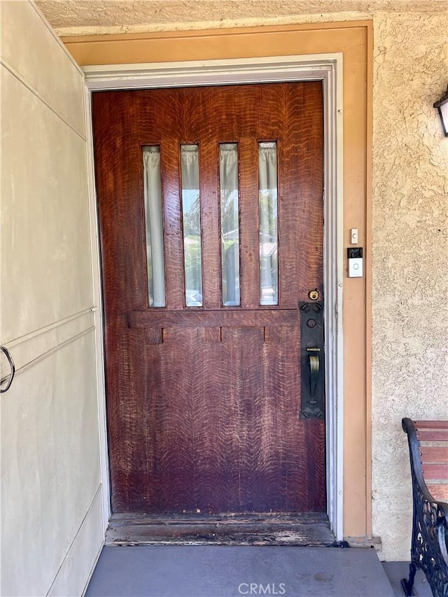 1323 W 41st Pl, Los Angeles, CA 90037 - doorway to property with stucco siding