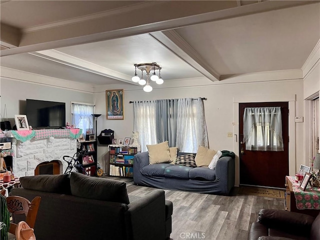 1323 W 41st Pl, Los Angeles, CA 90037 - living room featuring wood finished floors, beam ceiling, a chandelier, and ornamental molding