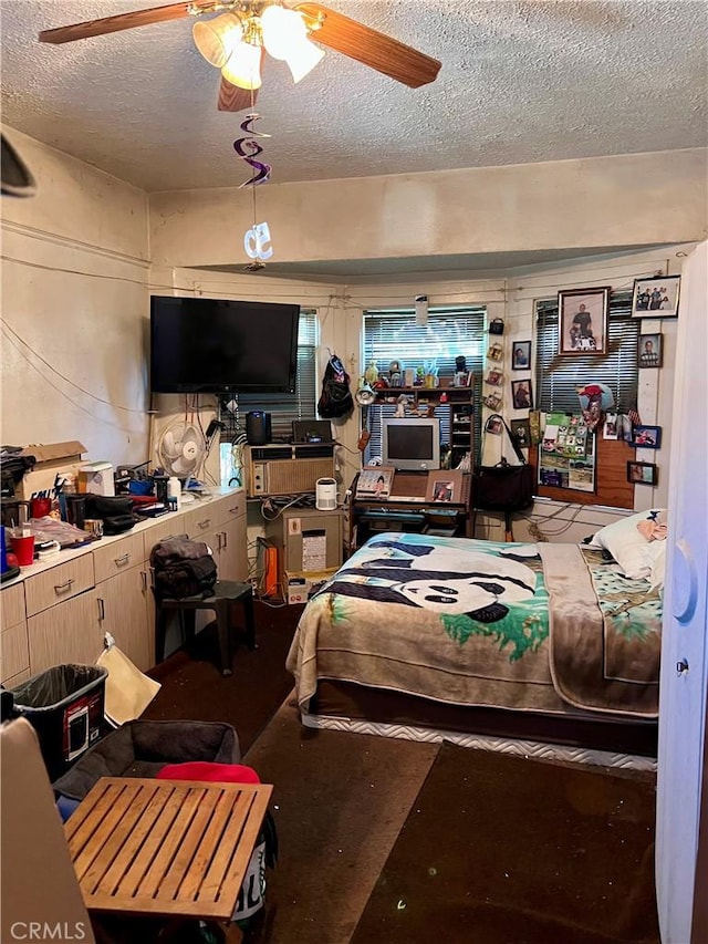 1323 W 41st Pl, Los Angeles, CA 90037 - bedroom featuring a textured ceiling and a ceiling fan