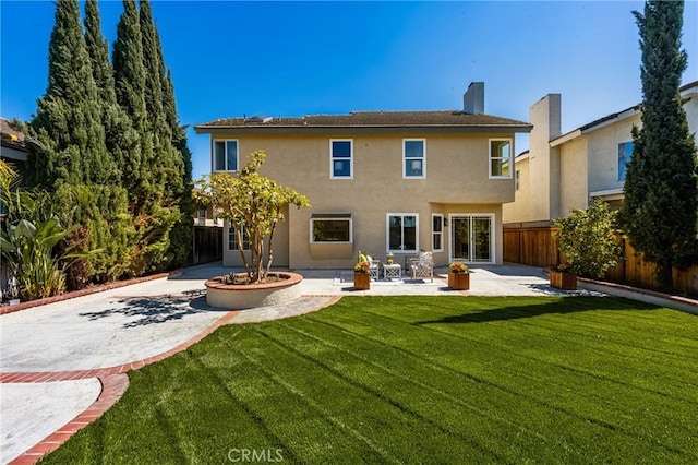 19 Jefferson, Irvine, CA 92620 - rear view of house featuring a patio, stucco siding, and a chimney