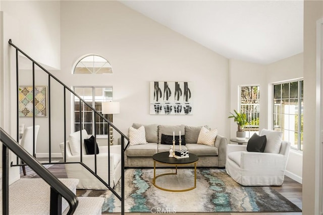 19 Jefferson, Irvine, CA 92620 - living room with wood finished floors, stairs, plenty of natural light, and high vaulted ceiling