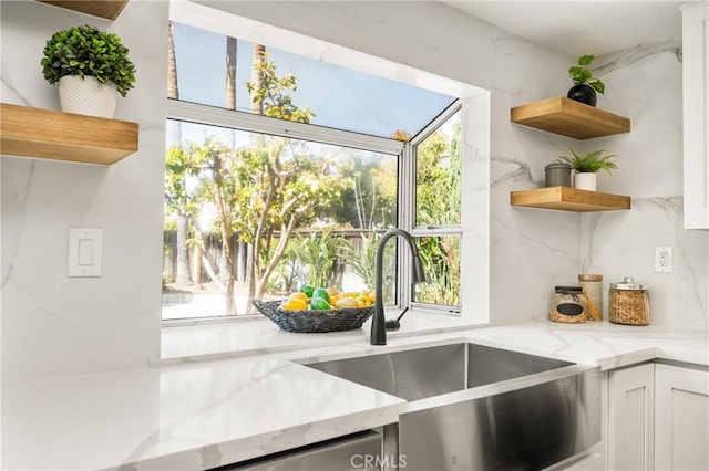 19 Jefferson, Irvine, CA 92620 - kitchen featuring open shelves, light stone countertops, plenty of natural light, and white cabinetry