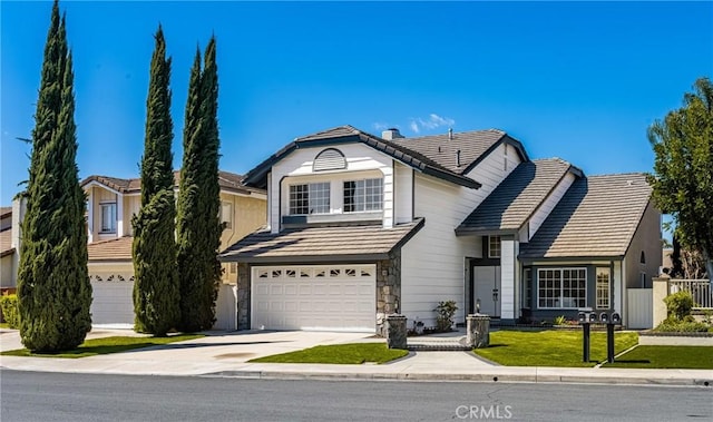 19 Jefferson, Irvine, CA 92620 - traditional-style house with driveway, an attached garage, a tiled roof, and stone siding