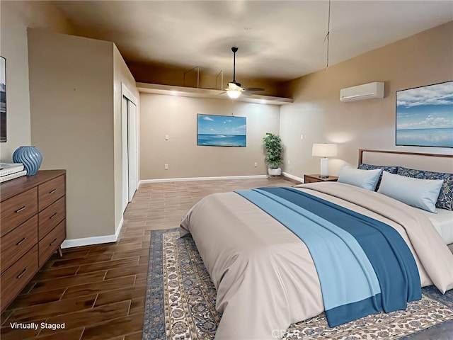 8103 David Way, Jurupa Valley, CA 92509 - bedroom with a wall mounted AC, wood tiled floors, and a ceiling fan