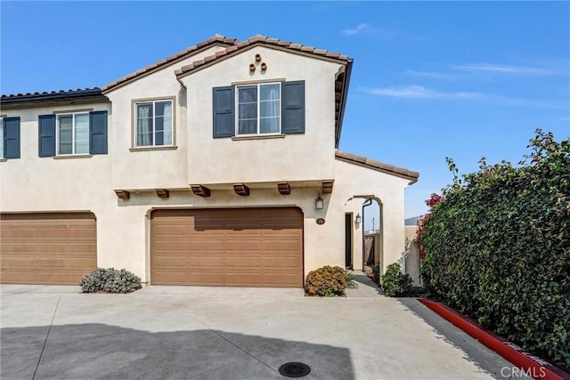 70 Linden Ln, Temple City, CA 91780 - view of front of house featuring a garage, stucco siding, concrete driveway, and a tiled roof