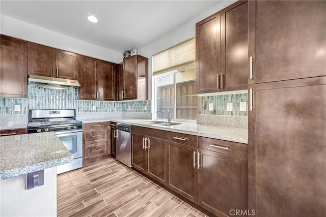 70 Linden Ln, Temple City, CA 91780 - kitchen featuring appliances with stainless steel finishes, under cabinet range hood, tasteful backsplash, dark brown cabinets, and light wood-style flooring