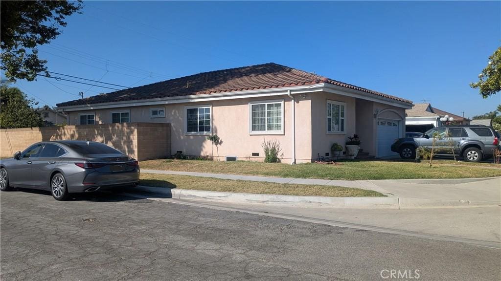 9303 Foster Rd, Downey, CA 90242 - view of front of home featuring crawl space, stucco siding, and a tiled roof