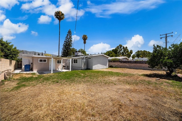 610 W Glen Lyn Dr, Glendora, CA 91740 - rear view of property with a patio, a fenced backyard, and stucco siding