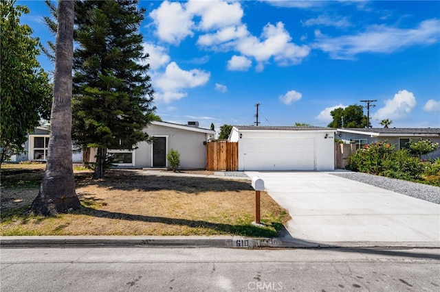 610 W Glen Lyn Dr, Glendora, CA 91740 - view of front of property with driveway, stucco siding, and a garage