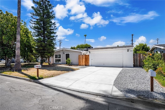 610 W Glen Lyn Dr, Glendora, CA 91740 - view of front facade with stucco siding, driveway, and a garage