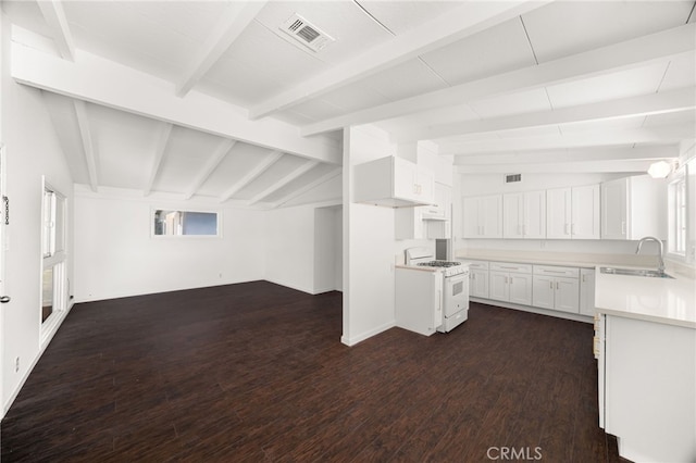 610 W Glen Lyn Dr, Glendora, CA 91740 - kitchen featuring white gas range oven, dark wood finished floors, white cabinetry, light countertops, and open floor plan