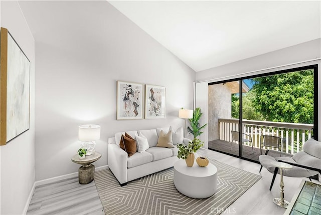 90 Lakepines Unit 5B, Irvine, CA 92620 - living area featuring wood finished floors and high vaulted ceiling