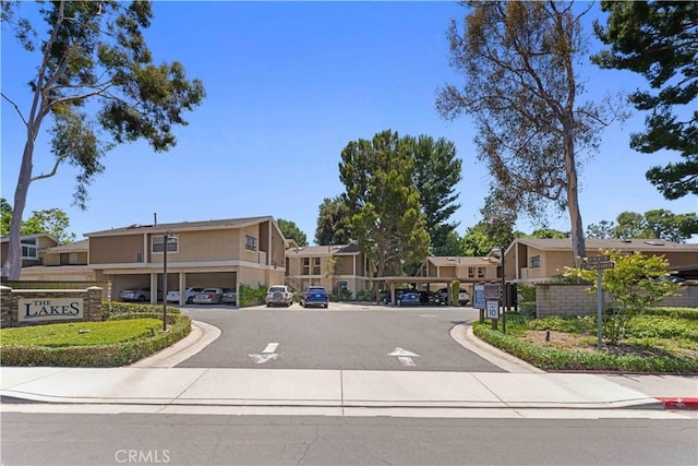 90 Lakepines Unit 5B, Irvine, CA 92620 - view of asphalt road with a residential view, curbs, and sidewalks