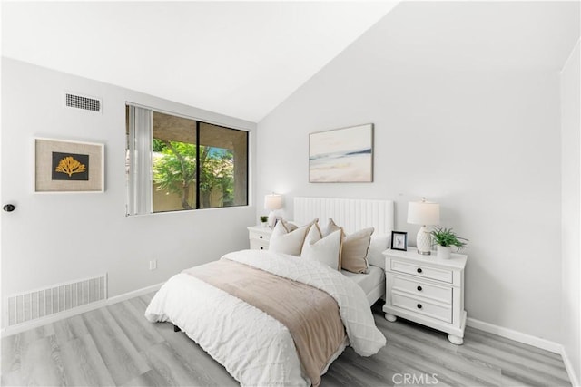 90 Lakepines Unit 5B, Irvine, CA 92620 - bedroom featuring light wood-style flooring and vaulted ceiling