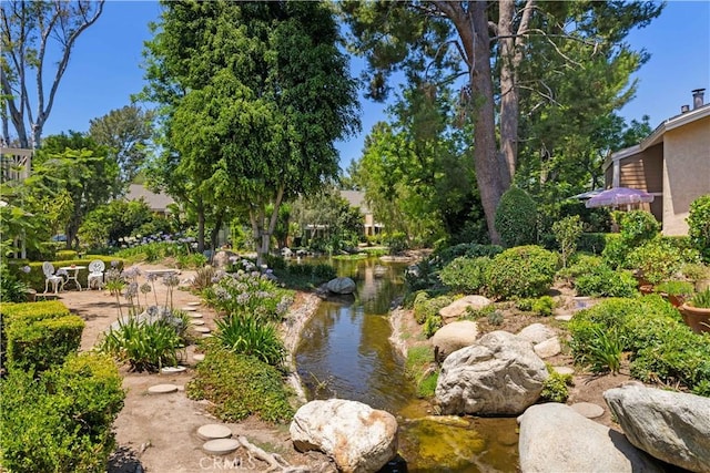 90 Lakepines Unit 5B, Irvine, CA 92620 - view of property's community featuring a garden pond