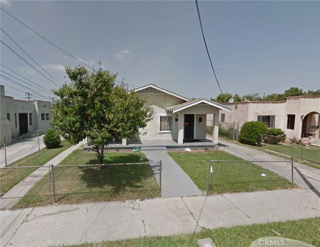 119 Chester Ave N, Compton, CA 90221 - view of front of home with a fenced front yard and stucco siding
