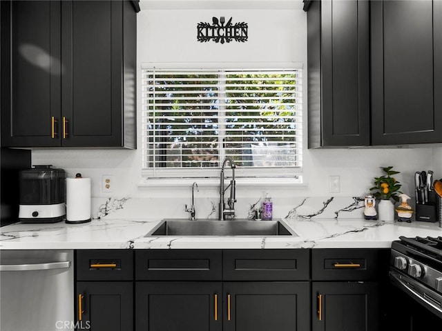 1324 Windermere Ct, Palmdale, CA 93551 - kitchen featuring dishwasher, light stone counters, and dark cabinetry