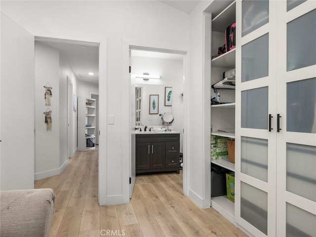 1324 Windermere Ct, Palmdale, CA 93551 - corridor featuring light wood finished floors and recessed lighting