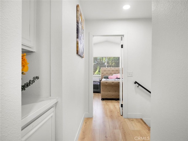 1324 Windermere Ct, Palmdale, CA 93551 - corridor featuring light wood-style floors, an upstairs landing, and recessed lighting