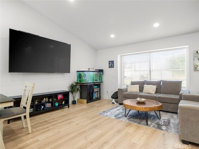 1324 Windermere Ct, Palmdale, CA 93551 - living room with wood finished floors, vaulted ceiling, and recessed lighting