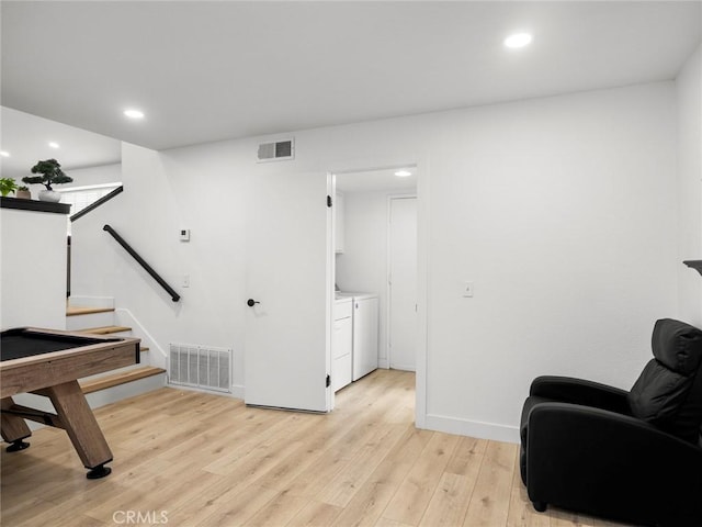 1324 Windermere Ct, Palmdale, CA 93551 - living area featuring washing machine and clothes dryer, light wood-type flooring, recessed lighting, and stairway