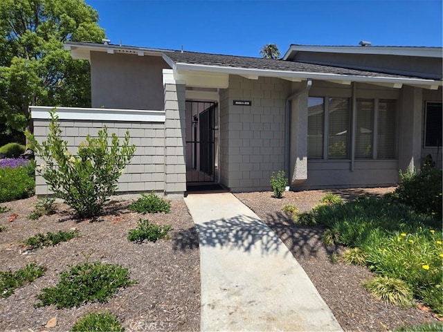 8566 Larkhall Cir Unit 808A, Huntington Beach, CA 92646 - property entrance featuring a shingled roof