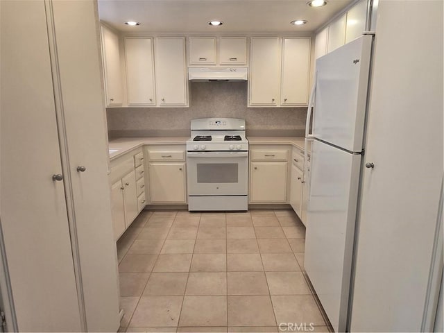 8566 Larkhall Cir Unit 808A, Huntington Beach, CA 92646 - kitchen with white appliances, under cabinet range hood, light countertops, light tile patterned floors, and recessed lighting