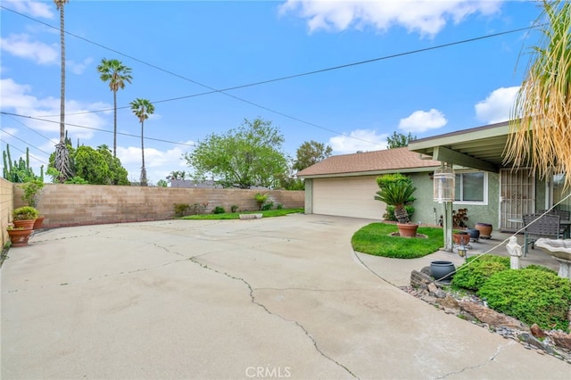 17655 Vine Ct, Fontana, CA 92335 - view of patio / terrace with a garage