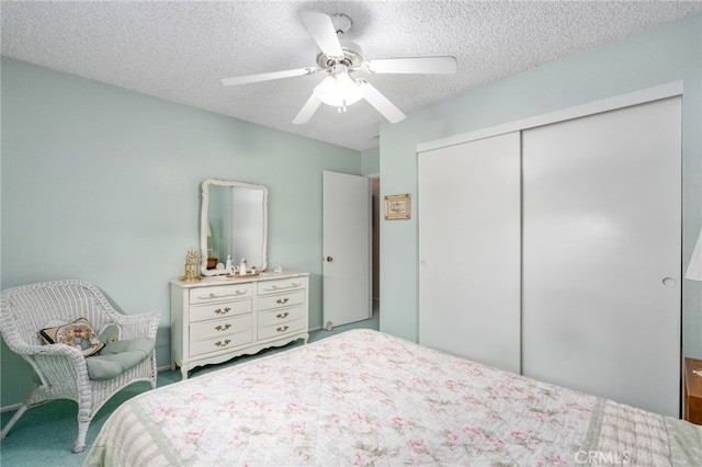 17655 Vine Ct, Fontana, CA 92335 - carpeted bedroom with a closet, a textured ceiling, and a ceiling fan