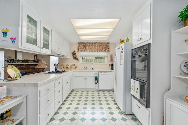 17655 Vine Ct, Fontana, CA 92335 - kitchen featuring white appliances, white cabinets, and under cabinet range hood