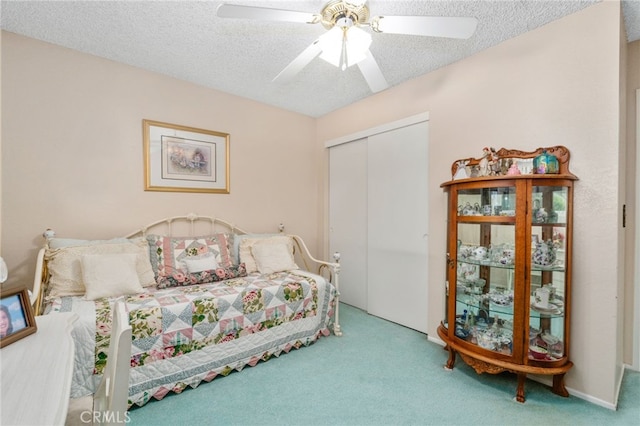 17655 Vine Ct, Fontana, CA 92335 - bedroom featuring carpet, a closet, a textured ceiling, and a ceiling fan
