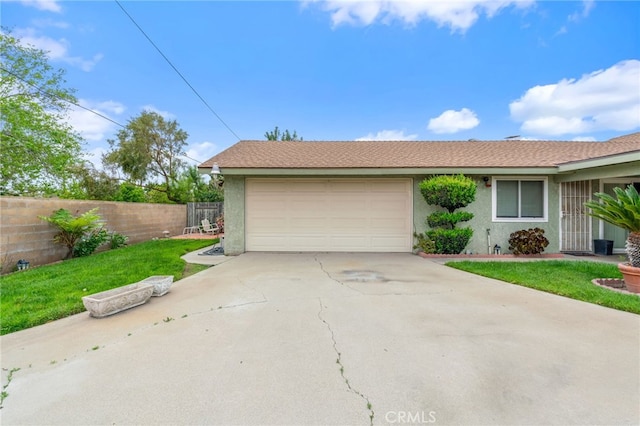 17655 Vine Ct, Fontana, CA 92335 - view of front of property featuring a garage, concrete driveway, and stucco siding