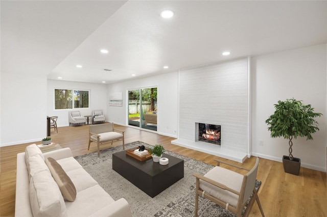 733 S Grove St, Redlands, CA 92374 - living area with recessed lighting, a fireplace, and wood finished floors