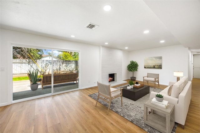 733 S Grove St, Redlands, CA 92374 - living room featuring wood finished floors, recessed lighting, and a fireplace