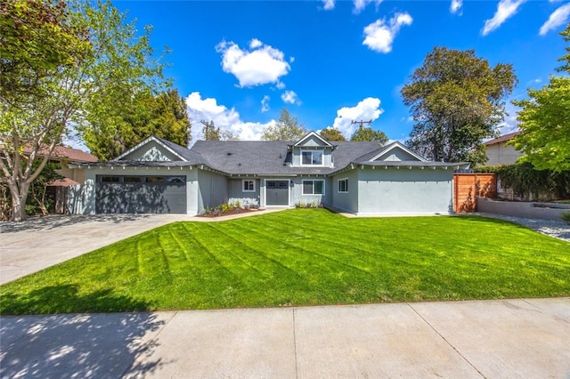 733 S Grove St, Redlands, CA 92374 - view of front of property featuring an attached garage, a front lawn, and driveway