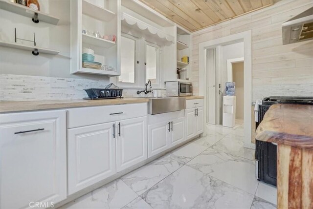 6093 Troth St, Jurupa Valley, CA 91752 - kitchen featuring open shelves, light marble finish flooring, wooden ceiling, white cabinets, and light countertops
