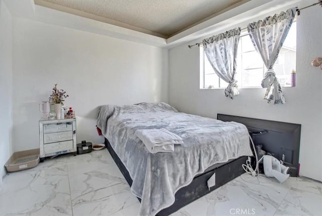 6093 Troth St, Jurupa Valley, CA 91752 - bedroom featuring a raised ceiling, a textured ceiling, and marble look tiles