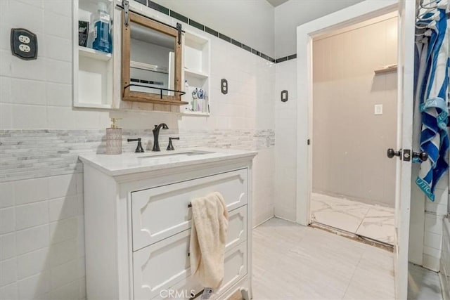 6093 Troth St, Jurupa Valley, CA 91752 - bathroom featuring vanity and tile walls