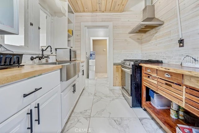 6093 Troth St, Jurupa Valley, CA 91752 - kitchen featuring appliances with stainless steel finishes, exhaust hood, light marble finish floors, wooden walls, and wood ceiling