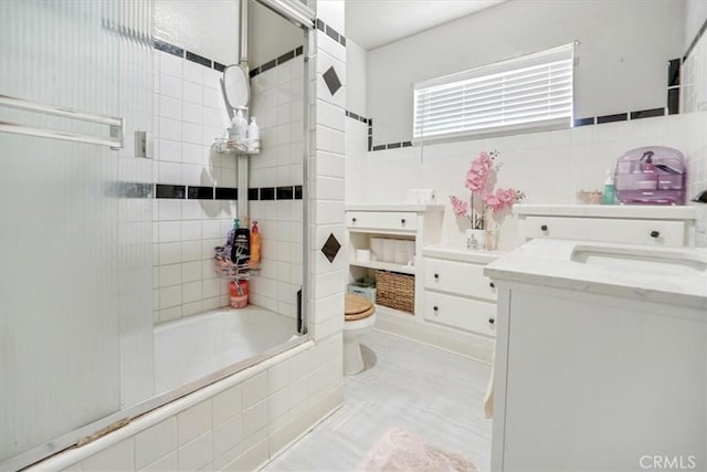 6093 Troth St, Jurupa Valley, CA 91752 - bathroom with vanity, tiled shower / bath, tile walls, and tile patterned floors