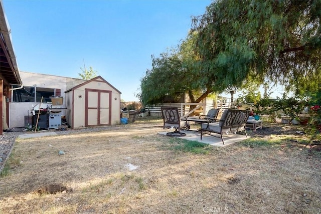 6093 Troth St, Jurupa Valley, CA 91752 - view of yard featuring a storage unit and a patio area