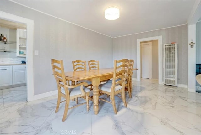 6093 Troth St, Jurupa Valley, CA 91752 - dining space with a heating unit, light marble finish flooring, and crown molding