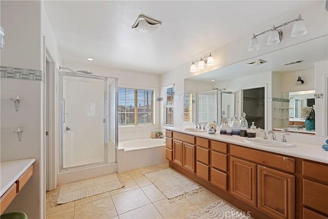 750 Multnomah Ct, San Jacinto, CA 92582 - full bathroom with a stall shower, double vanity, a garden tub, tile patterned floors, and a spacious closet