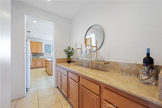 750 Multnomah Ct, San Jacinto, CA 92582 - indoor dry bar with freestanding refrigerator, light tile patterned flooring, recessed lighting, and backsplash